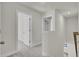 Upstairs hallway with carpet and access to bedrooms at 5629 Ellington School Rd, Ravenel, SC 29470