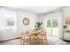 Modern dining room featuring a round table, chairs, and large sliding glass doors at 6249 Gritman Dr, Hollywood, SC 29470