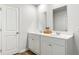 Clean bathroom with double vanity and light wood flooring at 6261 Gritman Dr, Hollywood, SC 29470