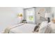 Bright bedroom with a comfortable bed and large window at 6261 Gritman Dr, Hollywood, SC 29470