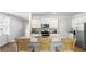 White kitchen with island, granite countertops, and stainless steel appliances at 6261 Gritman Dr, Hollywood, SC 29470