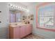 Pink vanity, mirror, and window in a playful bathroom at 780 Post Oak Dr, Mount Pleasant, SC 29464