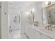 Elegant bathroom with double vanity, white cabinets, and marble floors at 780 Post Oak Dr, Mount Pleasant, SC 29464