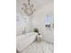 Spa-like bathroom with soaking tub, shiplap walls, and chandelier at 780 Post Oak Dr, Mount Pleasant, SC 29464