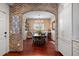 Charming dining room with brick accent wall and hardwood floors at 780 Post Oak Dr, Mount Pleasant, SC 29464