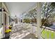 Spacious front porch with white railings, ceiling fan, and view of neighborhood at 780 Post Oak Dr, Mount Pleasant, SC 29464
