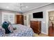 Main bedroom with large TV, dresser, and walk-in closets at 780 Post Oak Dr, Mount Pleasant, SC 29464
