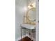 Elegant powder room with patterned wallpaper, round mirror, and pedestal sink at 780 Post Oak Dr, Mount Pleasant, SC 29464