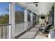Relaxing screened porch with seating and views of the outdoors at 780 Post Oak Dr, Mount Pleasant, SC 29464