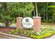 Grove Park community entrance with brick columns and landscaping at 904 W Marymont Ln, Charleston, SC 29414