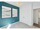 Spacious bedroom with a teal accent wall, double doors, and plenty of natural light at 1018 Currant Rd, Summerville, SC 29485