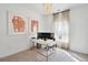 Bright home office features a workspace with two monitors and natural light from a large window at 1018 Currant Rd, Summerville, SC 29485