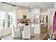 Bright kitchen with white cabinets, a kitchen island, and breakfast nook at 1018 Currant Rd, Summerville,  29485