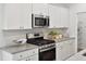 Modern kitchen with stainless steel appliances and granite countertops at 1018 Currant Rd, Summerville, SC 29485