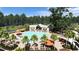 Relaxing pool area with a swim-up bar and plenty of lounge chairs at 1018 Currant Rd, Summerville, SC 29485