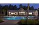 Night view of the clubhouse pool area with a bar and large screen TVs at 1018 Currant Rd, Summerville, SC 29485