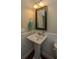 Charming bathroom with pedestal sink and beadboard wainscot at 109 Rawlins Dr, Summerville,  29485