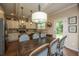 Kitchen and dining area with dark wood table and access to backyard at 109 Rawlins Dr, Summerville,  29485