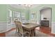 Spacious dining room with light green walls and hardwood floors at 130 Sarmiento Ln, Summerville,  29483