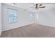 Well-lit bedroom with two windows, ceiling fan and carpet flooring at 131 Rockingham Way, Moncks Corner,  29461