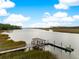 Aerial view of waterfront property with private dock, gazebo, and kayak at 147 Bobcat Ln, Kiawah Island, SC 29455