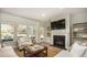 Living room with fireplace, large windows, and comfortable seating at 173 Belfort Pl, Summerville,  29486