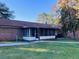 Brick house with screened porch, yard, and satellite dish at 1848 N Highway 15, Saint George,  29477