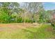 Large backyard with mature trees and a shed at 185 Old Fort Dr, Ladson, SC 29456