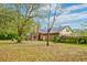 Spacious backyard with brick home, mature trees and a gazebo at 185 Old Fort Dr, Ladson, SC 29456