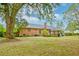 Large backyard with mature trees and a view of the home's back at 185 Old Fort Dr, Ladson, SC 29456