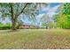 Large backyard with mature trees and open space at 185 Old Fort Dr, Ladson, SC 29456