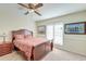 Bedroom with wood sleigh bed, window, and framed art at 185 Old Fort Dr, Ladson, SC 29456