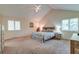 Spacious bedroom with vaulted ceiling, carpeted floor, and large windows at 185 Old Fort Dr, Ladson, SC 29456