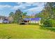 Brick ranch home with solar panels and spacious yard at 185 Old Fort Dr, Ladson, SC 29456