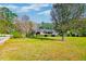 Brick home with solar panels, spacious lawn, and mature trees at 185 Old Fort Dr, Ladson, SC 29456