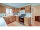 Eat-in kitchen with wood cabinets, stainless steel appliances, and tile floor at 185 Old Fort Dr, Ladson, SC 29456