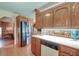 Spacious kitchen with wood cabinets, stainless steel appliances, and tile floor at 185 Old Fort Dr, Ladson, SC 29456