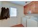 Laundry room with washer, dryer, and built-in cabinets at 185 Old Fort Dr, Ladson, SC 29456