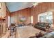 Living room with vaulted ceiling, brick fireplace and wood paneling at 185 Old Fort Dr, Ladson, SC 29456