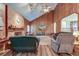 Vaulted ceiling living room with brick fireplace and wood paneling at 185 Old Fort Dr, Ladson, SC 29456