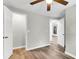 Bedroom with ceiling fan, doors to closet and hallway, and wood-look floors at 1979 Macon Ave, North Charleston, SC 29405