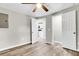 Bedroom with ceiling fan, doors leading to other rooms, and wood-look floors at 1979 Macon Ave, North Charleston, SC 29405
