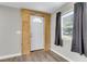 Inviting entryway with wood-paneled accent wall and vinyl flooring at 1979 Macon Ave, North Charleston, SC 29405