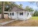 Recently remodeled white cottage featuring a covered porch at 1979 Macon Ave, North Charleston, SC 29405