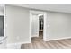 View down a hallway with light gray walls and wood-look flooring at 1979 Macon Ave, North Charleston, SC 29405