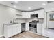 Modern kitchen with stainless steel appliances and white cabinets at 1979 Macon Ave, North Charleston, SC 29405