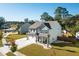 Two-story house with gray siding, white garage door, and landscaped yard at 2009 Elvington Rd, Johns Island, SC 29455