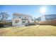 Sunny backyard view of home's exterior and patio at 2009 Elvington Rd, Johns Island, SC 29455