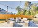 Backyard patio with a fire pit and circular seating at 2009 Elvington Rd, Johns Island, SC 29455