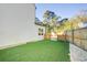 Artificial turf backyard with wooden fence and storage shed at 2009 Elvington Rd, Johns Island, SC 29455